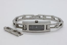 A DESIGNER LADIES SILVER TONE WRIST WATCH ON AN OPEN WORK BRACELET STRAP MARKED GUCCI 3900 L & A