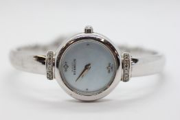A DESIGNER LADIES SILVER TONE BANGLE BRACELET WRIST WATCH MARKED 