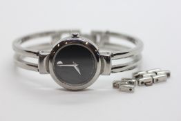 A DESIGNER LADIES SILVER TONE MUSEUM BANGLE BRACELET WRIST WATCH MARKED 