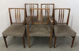 A SET OF 5 MID CENTURY TEAK DINING CHAIRS TO INCLUDE A CARVER, GORDON RUSSELL FOR HEALS.