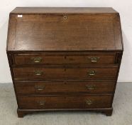 AN ANTIQUE OAK BUREAU WITH 4 DRAWERS, W 97CM, D 52CM, H 101CM.
