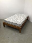 A HONEY PINE DOUBLE BED FRAME WITH A CUMFILUX MATTRESS, 145CM X 191CM X 94CM.