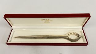 A SOLID SILVER LETTER OPENER, SHEFFIELD 1991, BEARING PRESENTATION INSCRIPTION.