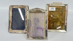 THREE SILVER PHOTOGRAPH FRAMES, THE LARGEST 18 X 13CM.