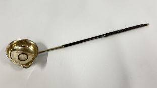AN ANTIQUE WHITE METAL TODDY / PUNCH LADLE. L 34.5.