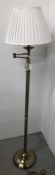 A GOOD QUALITY BRUSHED BRASS LAMP STANDARD WITH CREAM PLEATED SHADE - SOLD AS SEEN.