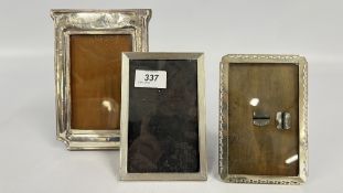 THREE SILVER PHOTOGRAPH FRAMES, THE LARGEST 19.5 X 13CM.