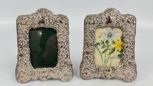 A PAIR OF EMBOSSED DESIGN SILVER PHOTOGRAPH FRAMES BIRMINGHAM ASSAY MAKER RH, HEIGHT 15.5CM.