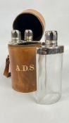 A VINTAGE CYLINDRICAL TAN LEATHER HUNTING FLASK SET BEARING INITIALS A.D.S.
