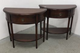 TWO MODERN SINGLE DRAWER HALF MOON SIDE TABLES WITH LOWER SHELF, W 85CM.