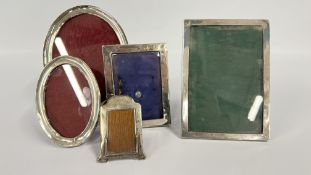 FIVE VARIOUS OVAL AND RECTANGULAR SILVER PHOTOGRAPH FRAMES A/F CONDITION, THE LARGEST 22 X 16CM.
