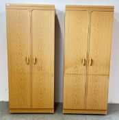 A PAIR OF MODERN TWO DOOR BEECH WOOD FINISH WARDROBES, W 76 X D 51 X H 184.5CM.