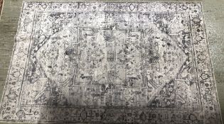 TWO DESIGNER FLOOR RUGS TO INCLUDE A JUTE EXAMPLE AND ONE OTHER CLASSIC DESIGN.