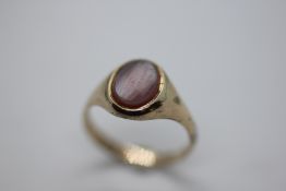 A 9CT GOLD SIGNET RING.