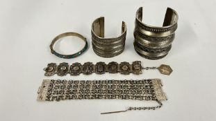 TWO WHITE METAL PERSIAN STYLE CUFF BRACELETS, ENAMEL HINGED BANGLE AND A FOUR STRAND BRACELET,