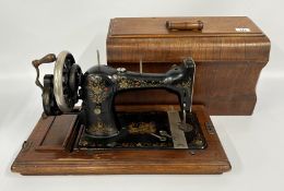 A VINTAGE SINGER SEWING MACHINE WITH KEYS - SOLD AS SEEN.