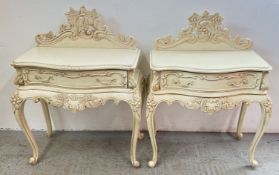 A PAIR OF CONTINENTAL DESIGN ORNATE CREAM PAINTED BEDSIDE SINGLE DRAWER STANDS,