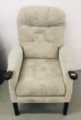 A MODERN OATMEAL UPHOLSTERED HIGH SEAT EASY CHAIR.