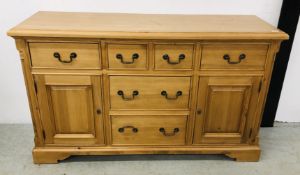 A PINE MULTI 6 DRAWER SIDEBOARD WITH CUPBOARDS TO ENDS, W 149CM X D 48CM X H 88CM.