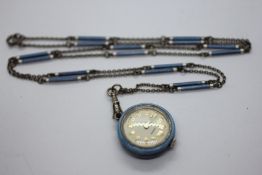 AN ANTIQUE WHITE METAL AND GUILLOCHE ENAMEL WATCH PENDANT AND CHAIN.