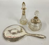 TWO VINTAGE SILVER RIMMED SCENT DECANTERS & A SILVER BACK DRESSING TABLE MIRROR, BIRMINGHAM ASSAY.