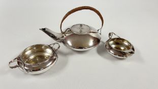 A WILLIAM H HASELER SILVER THREE PIECE TEA SET DESIGNED BY ARCHIBALD KNOX COMPRISING TEAPOT & COVER,