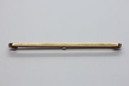 A 9CT GOLD TIE PIN.