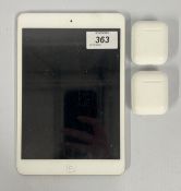 IPAD MINI PLUS TWO PAIRS OF APPLE EAR PODS - SOLD AS SEEN.