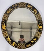 A VINTAGE OVAL BLACK LACQUER CHINOISERIE WALL MIRROR.