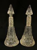 A PAIR OF ANTIQUE SCENT DECANTERS WITH SILVER BANDING, (A/F) INDISTINCT HALL MARK H = 19CM.