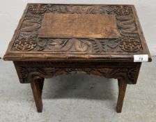 A HEAVILY CARVED ORIENTAL DESIGN FOLDING OCCASIONAL TABLE, W 41, D 30, H 34CM.