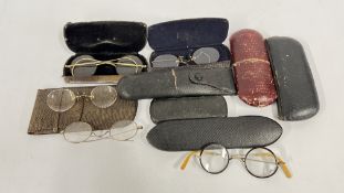 A GROUP OF VINTAGE SPECTACLES TO INCLUDE YELLOW METAL FRAMED EXAMPLES.