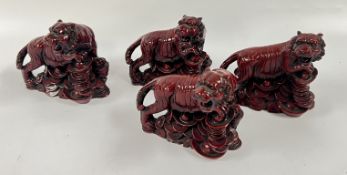 4 X RESIN CHINESE TIGER SCULPTURES.