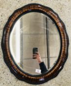 ANTIQUE OVAL MAHOGANY FINISH WALL MIRROR.