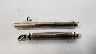 A SILVER SAMPSON MORDAN PROPELLING PENCIL + A FURTHER WHITE METAL ENGINE TURNED EXAMPLE.