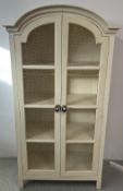 MODERN CONTINENTAL DESIGN TWO DOOR CAGED FRONT SHELVED CABINET, W 105 X D 54 X H 197CM.