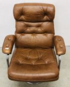 MID CENTURY CHROME FRAMED REVOLVING RELAXER CHAIR WITH BROWN FAUX LEATHER BUTTON BACK UPHOLSTERY.