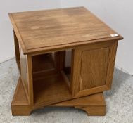 A BESPOKE SOLID OAK REVOLVING BOOKSHELF.