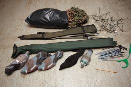 AN ASSORTMENT OF PIGEON DECOYS, DEAD BIRD CRADLES, CAMOUFLAGE HIDE NETS AND HIDE POLES,