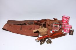 A GROUP OF SHOOTING ACCESSORIES TO INCLUDE 12 GAUGE CARTRIDGES, GUN SLEEVES, CLEANING ACCESSORIES,
