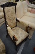 A 19th century faux rosewood framed open armchair.