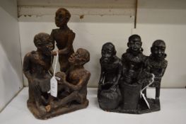 Two terracotta African figure groups.