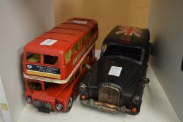 Tin plate model of a London bus and a London taxi.