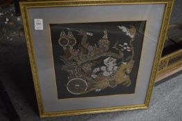 An Indian painting on silk depicting a figure in a chariot together with an embroidered picture.