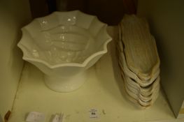 A jelly mould and six corn on the cob holders.