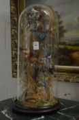 Taxidermy group of birds under a glass dome.
