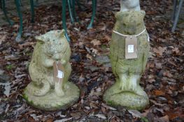 Two reconstituted stone garden ornaments, one modelled as a owl the other a cat licking its paw.