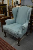 A good George III design wing armchair with classical turquoise upholstery on carved cabriole legs