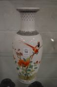 A Chinese baluster shaped vase painted with birds amongst flowers.