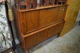 A teak cocktail cabinet.